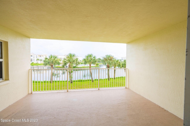 8941 Lake Dr Unit 204, Cape Canaveral, FL 32920 - view of patio with a water view and a balcony