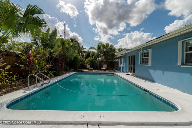 view of swimming pool with a fenced in pool and a fenced backyard