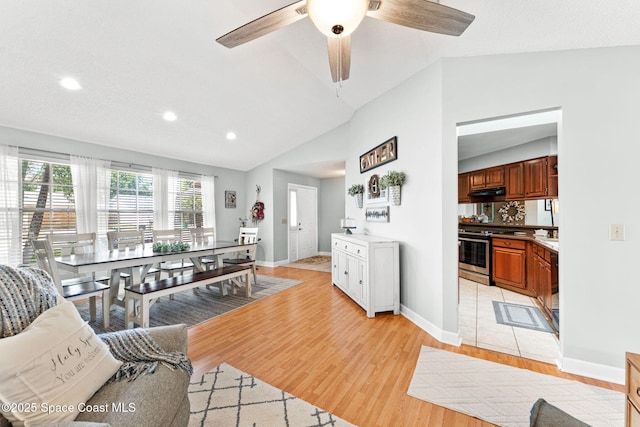 living area with lofted ceiling, baseboards, recessed lighting, light wood-style flooring, and ceiling fan
