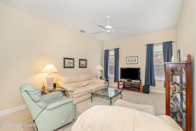 3156 Quint Dr, Melbourne, FL 32940 - living room featuring light colored carpet, a ceiling fan, baseboards, and healthy amount of natural light