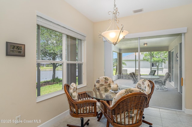 3156 Quint Dr, Melbourne, FL 32940 - tiled dining area featuring plenty of natural light, a water view, and baseboards