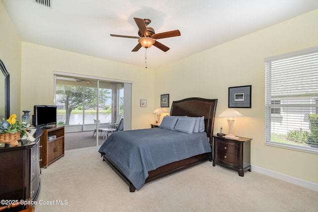3156 Quint Dr, Melbourne, FL 32940 - bedroom with access to exterior, light colored carpet, and multiple windows