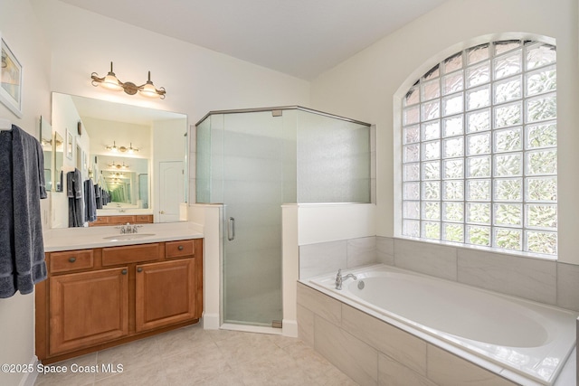 3156 Quint Dr, Melbourne, FL 32940 - full bath with vanity, a bath, a stall shower, and tile patterned flooring