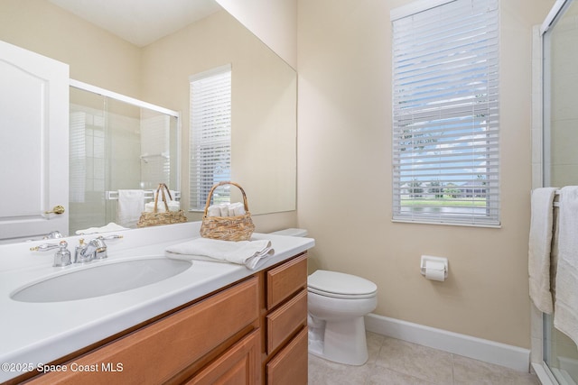 3156 Quint Dr, Melbourne, FL 32940 - bathroom with vanity, tile patterned flooring, a shower stall, toilet, and baseboards