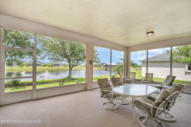 3156 Quint Dr, Melbourne, FL 32940 - sunroom featuring a water view, carpet floors, and a residential view