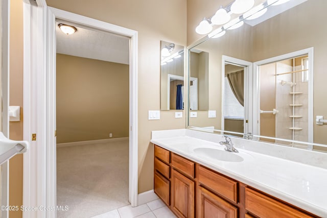 603 Manatee Bay Dr, Cape Canaveral, FL 32920 - bathroom with vanity, tile patterned flooring, and baseboards