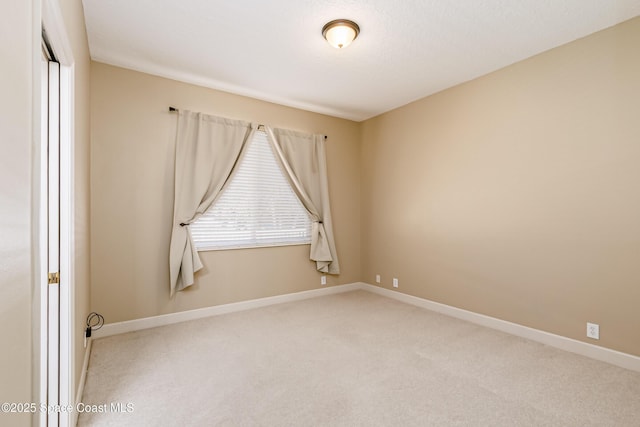 603 Manatee Bay Dr, Cape Canaveral, FL 32920 - carpeted spare room featuring baseboards