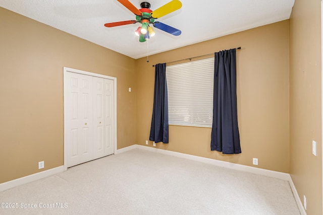 603 Manatee Bay Dr, Cape Canaveral, FL 32920 - carpeted empty room with ceiling fan and baseboards