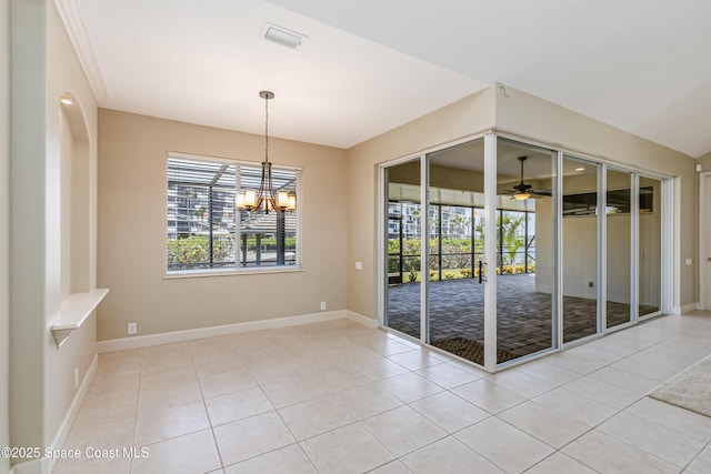 603 Manatee Bay Dr, Cape Canaveral, FL 32920 - tiled spare room featuring healthy amount of natural light, a ceiling fan, a chandelier, and baseboards