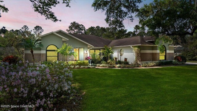 5395 Amy Way, Mims, FL 32754 - single story home featuring a yard and stucco siding
