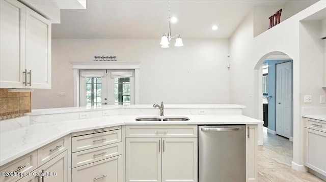 5395 Amy Way, Mims, FL 32754 - kitchen with arched walkways, a sink, light stone countertops, french doors, and stainless steel dishwasher