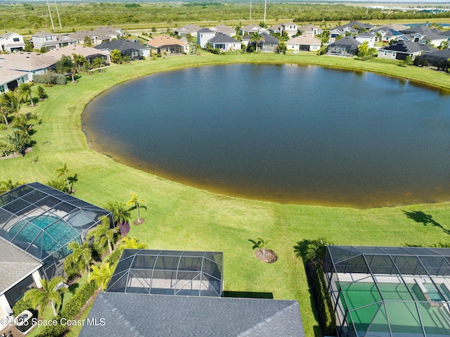 aerial view with a residential view and a water view