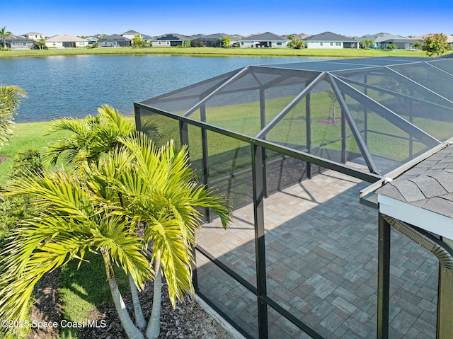 exterior space featuring a residential view and a water view