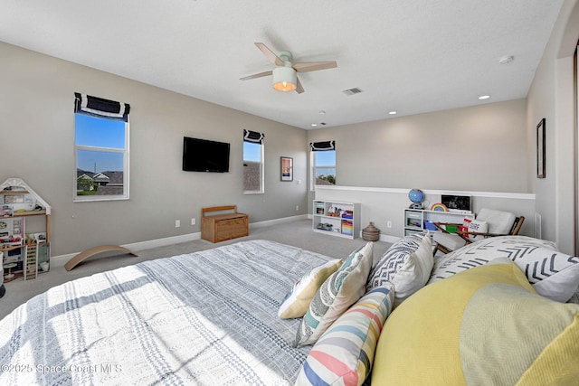 bedroom featuring ceiling fan, baseboards, carpet flooring, and visible vents