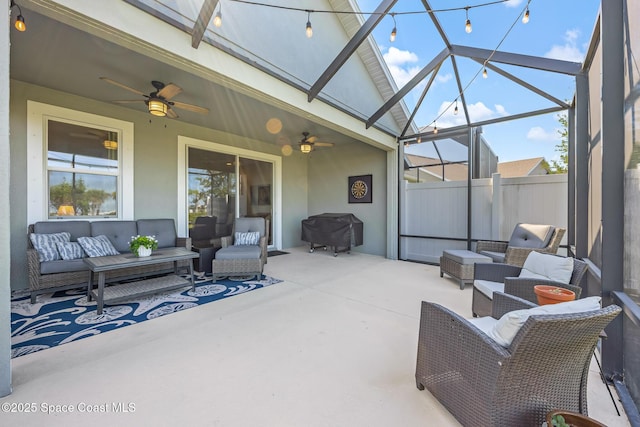 sunroom featuring ceiling fan and an outdoor hangout area