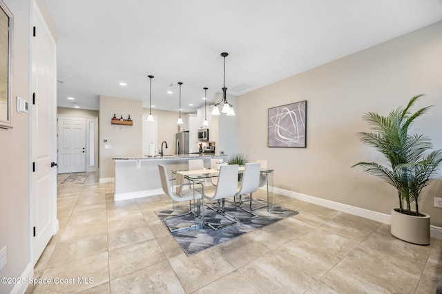 dining room featuring light tile patterned floors, baseboards, and recessed lighting