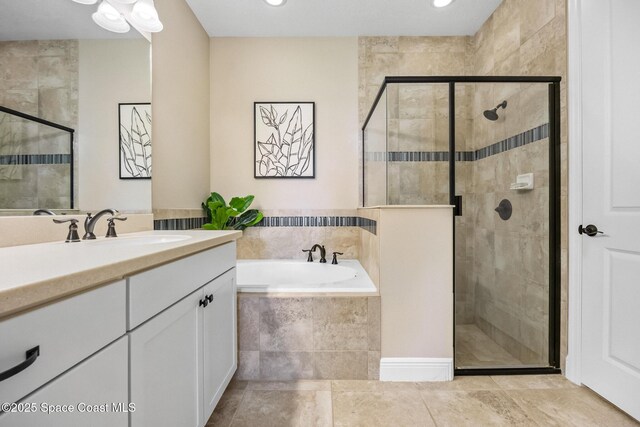 full bath featuring a shower stall, recessed lighting, vanity, and a bath