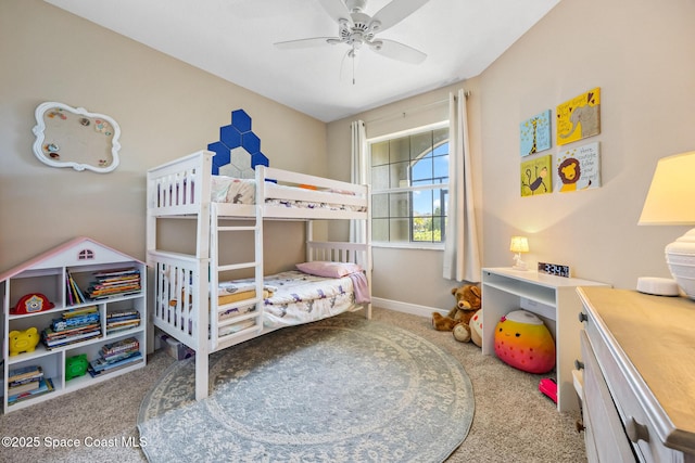 carpeted bedroom with a ceiling fan and baseboards