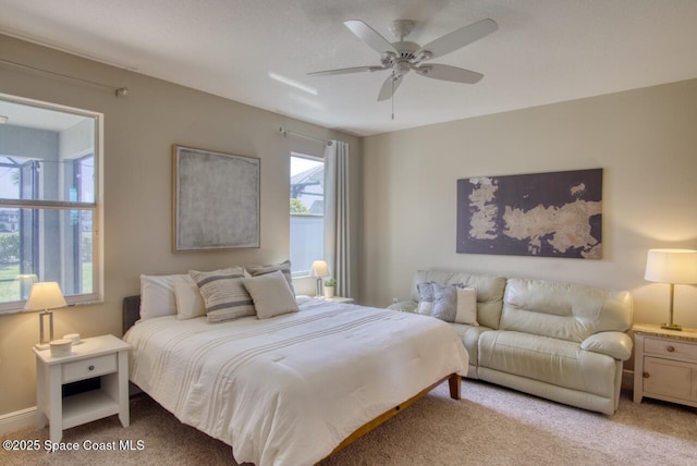 carpeted bedroom featuring a ceiling fan
