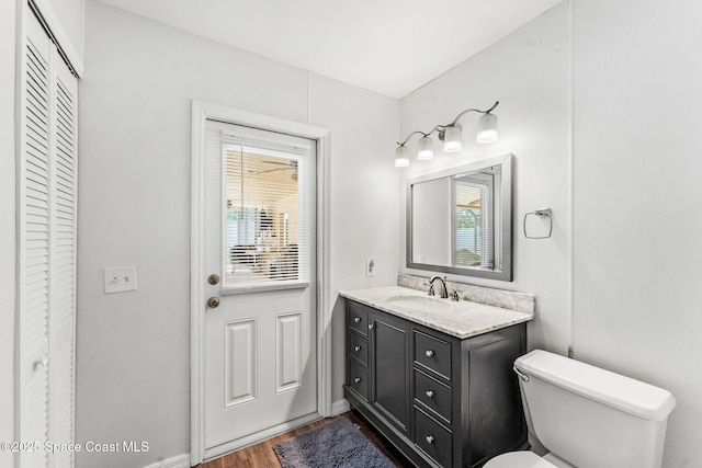 36 Mohican Way, Melbourne Beach, FL 32951 - bathroom featuring a closet, plenty of natural light, wood finished floors, and toilet