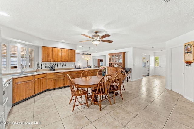 36 Mohican Way, Melbourne Beach, FL 32951 - dining area with ceiling fan, light tile patterned floors, a textured ceiling, plenty of natural light, and recessed lighting