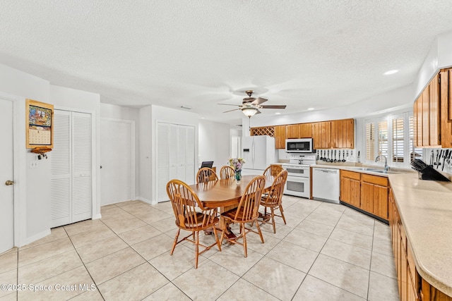 36 Mohican Way, Melbourne Beach, FL 32951 - dining space with light tile patterned floors, a ceiling fan, a textured ceiling, and recessed lighting
