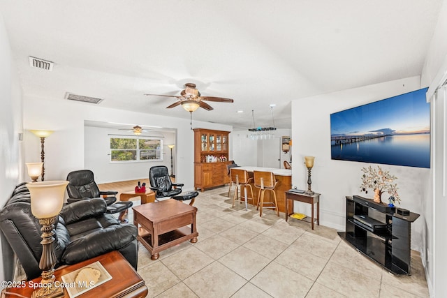 36 Mohican Way, Melbourne Beach, FL 32951 - living area featuring a ceiling fan, light tile patterned floors, baseboards, and bar area