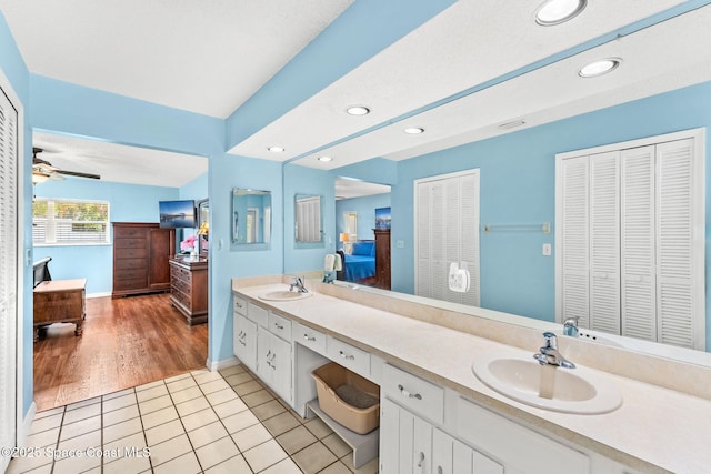 36 Mohican Way, Melbourne Beach, FL 32951 - bathroom with ensuite bathroom, a closet, double vanity, baseboards, and tile patterned floors