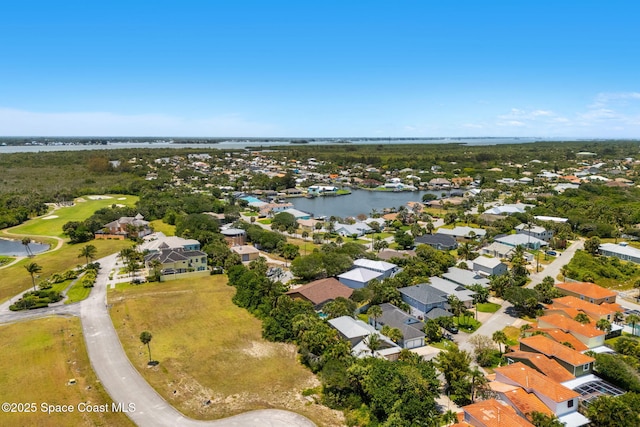 36 Mohican Way, Melbourne Beach, FL 32951 - aerial view of residential area with a nearby body of water and a golf course