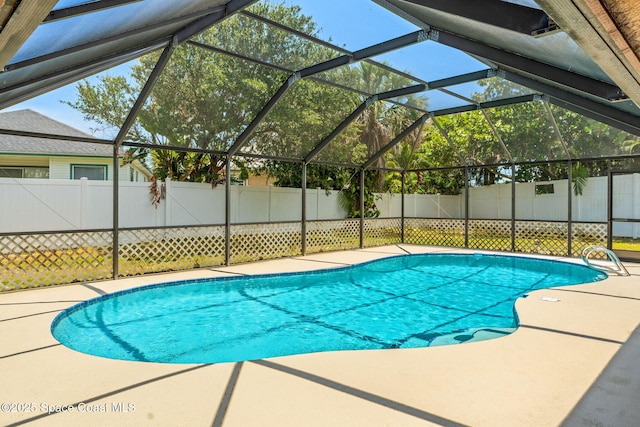 36 Mohican Way, Melbourne Beach, FL 32951 - view of swimming pool featuring fence, a patio area, and glass enclosure