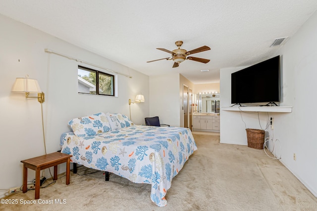 265 Sheridan Ave, Satellite Beach, FL 32937 - bedroom with a ceiling fan, light colored carpet, ensuite bath, and visible vents