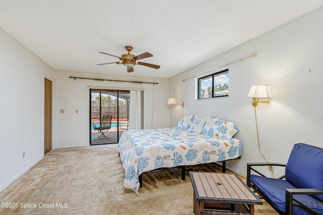 265 Sheridan Ave, Satellite Beach, FL 32937 - bedroom with ceiling fan, a textured ceiling, light colored carpet, baseboards, and access to outside