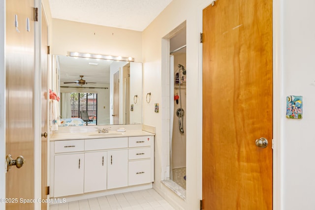 265 Sheridan Ave, Satellite Beach, FL 32937 - bathroom featuring ceiling fan, a shower stall, tile patterned floors, and vanity