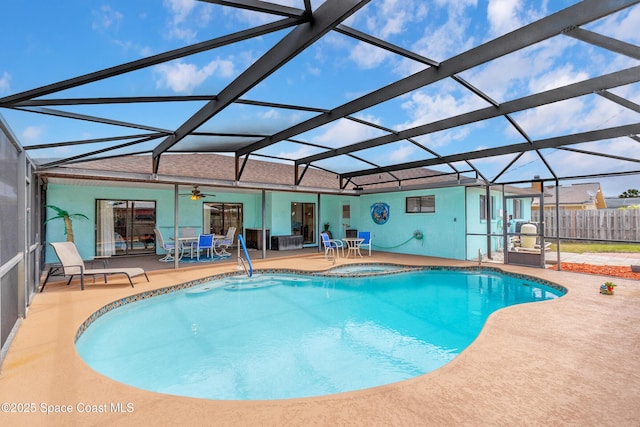 265 Sheridan Ave, Satellite Beach, FL 32937 - view of swimming pool with ceiling fan, fence, a patio area, glass enclosure, and a pool with connected hot tub