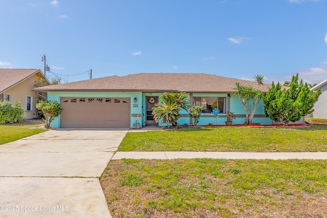 265 Sheridan Ave, Satellite Beach, FL 32937 - single story home with an attached garage, stucco siding, driveway, and a front lawn