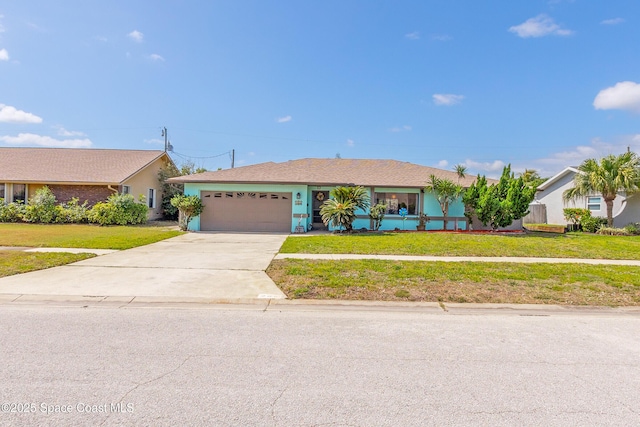 265 Sheridan Ave, Satellite Beach, FL 32937 - single story home with a garage, driveway, and a front yard