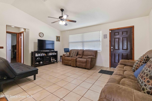 1019 Lee Ave NW, Palm Bay, FL 32907 - living room with light tile patterned flooring, a ceiling fan, and lofted ceiling