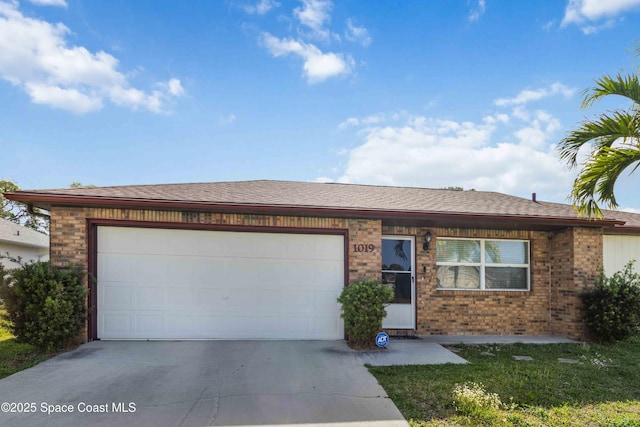 1019 Lee Ave NW, Palm Bay, FL 32907 - ranch-style home featuring a shingled roof, brick siding, driveway, and an attached garage