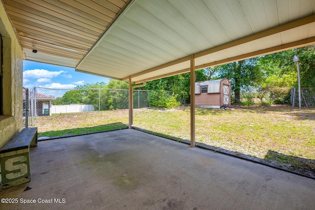 2102 E Parkton Dr, Deltona, FL 32725 - view of patio / terrace featuring a storage shed, an outbuilding, and a fenced backyard