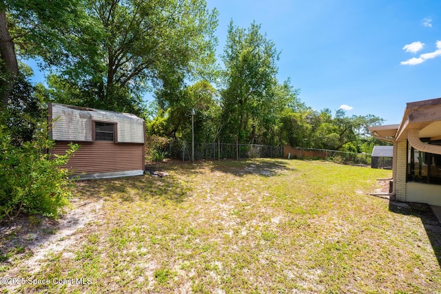 2102 E Parkton Dr, Deltona, FL 32725 - view of yard with an outdoor structure, a storage shed, and fence