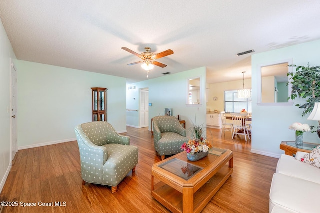 2102 E Parkton Dr, Deltona, FL 32725 - living room with baseboards, visible vents, wood finished floors, and ceiling fan