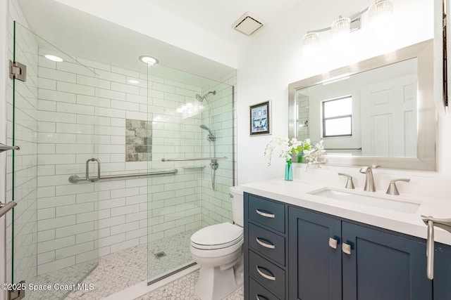 2102 E Parkton Dr, Deltona, FL 32725 - bathroom with visible vents, a shower stall, toilet, and vanity