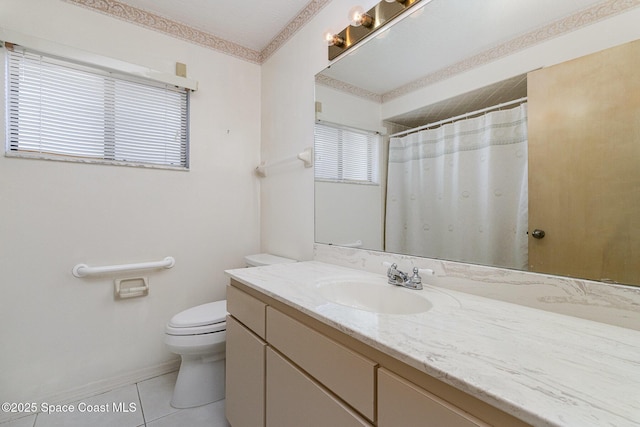 2062 Bottlebrush Dr, Melbourne, FL 32935 - bathroom featuring a wealth of natural light, tile patterned floors, vanity, and toilet