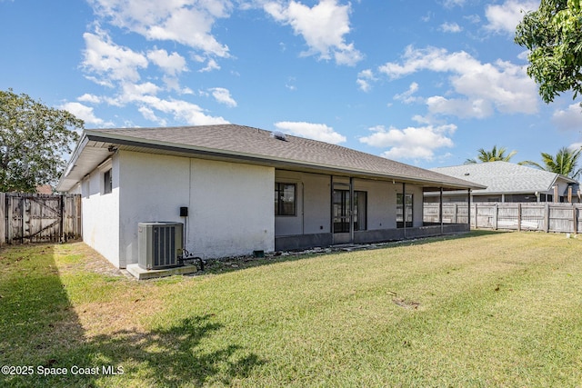 2062 Bottlebrush Dr, Melbourne, FL 32935 - rear view of house with a shingled roof, central air condition unit, a yard, a fenced backyard, and stucco siding