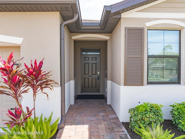 830 Remington Green Dr SE, Palm Bay, FL 32909 - entrance to property featuring stucco siding
