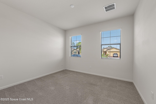 830 Remington Green Dr SE, Palm Bay, FL 32909 - carpeted empty room with baseboards and visible vents
