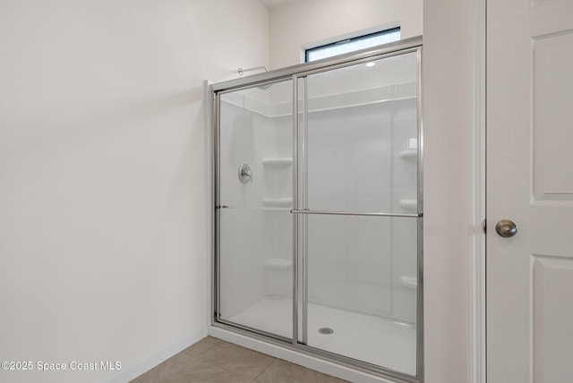 830 Remington Green Dr SE, Palm Bay, FL 32909 - full bath with baseboards, tile patterned floors, and a stall shower