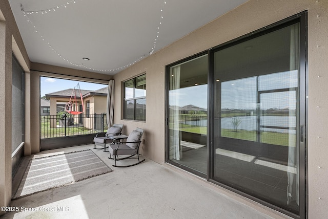 830 Remington Green Dr SE, Palm Bay, FL 32909 - sunroom / solarium with a water view and concrete flooring