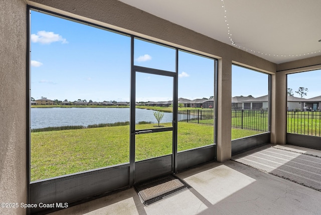 830 Remington Green Dr SE, Palm Bay, FL 32909 - unfurnished sunroom with a residential view, a water view, and a healthy amount of sunlight