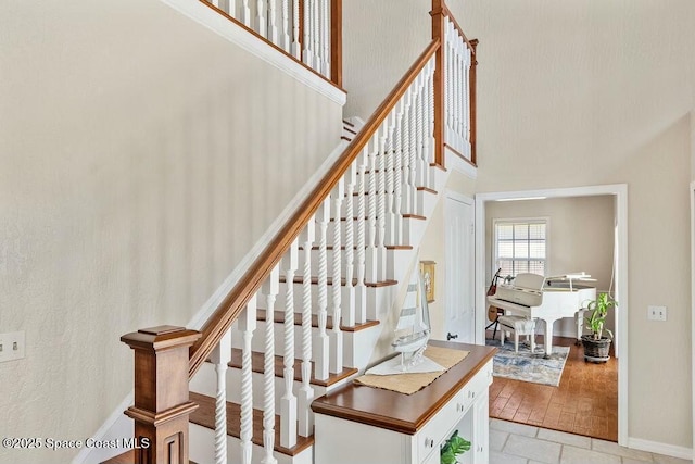 100 Woods S Dr, Merritt Island, FL 32952 - stairs with baseboards and a towering ceiling